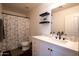 Well-lit bathroom featuring a white vanity, modern sink, and a large mirror at 8516 N 64Th Ave, Glendale, AZ 85302