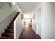 Inviting entryway with hardwood floors and staircase leading to the upper level at 8516 N 64Th Ave, Glendale, AZ 85302