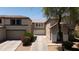 Exterior showcases a two story home, two-car garage, front yard and long driveway at 8516 N 64Th Ave, Glendale, AZ 85302