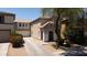 Exterior showcases a two story home, two-car garage, front yard and long driveway at 8516 N 64Th Ave, Glendale, AZ 85302