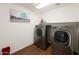 Functional laundry room with modern washer and dryer at 8516 N 64Th Ave, Glendale, AZ 85302
