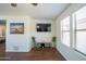 Cozy living room features hardwood floors, ample light, and entertainment center at 8516 N 64Th Ave, Glendale, AZ 85302