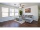 Bright living room with hardwood floors, comfortable seating, and ample natural light at 8516 N 64Th Ave, Glendale, AZ 85302
