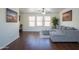 Comfortable living room with hardwood floors, natural light, and large gray sectional at 8516 N 64Th Ave, Glendale, AZ 85302