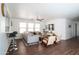 Bright living room with hardwood floors, neutral tones, and comfortable seating at 8516 N 64Th Ave, Glendale, AZ 85302