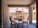 Covered outdoor patio, perfect for dining and entertaining with a table and chairs at 8516 N 64Th Ave, Glendale, AZ 85302