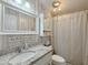 Bathroom featuring a granite vanity, decorative mirror, and shower-tub combo at 8600 E Broadway Rd # 88, Mesa, AZ 85208