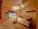 Cozy bedroom with natural light, ceiling fan, and comfortable furnishings at 8600 E Broadway Rd # 88, Mesa, AZ 85208