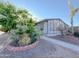 Well-maintained home exterior featuring landscaping and a manicured yard at 8600 E Broadway Rd # 88, Mesa, AZ 85208
