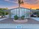 Charming home with desert landscaping, covered parking, and beautiful sunset skies at 8600 E Broadway Rd # 88, Mesa, AZ 85208