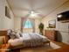 Relaxing main bedroom with a ceiling fan and a comfy bed at 8600 E Broadway Rd # 88, Mesa, AZ 85208