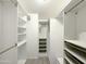 Spacious walk-in closet featuring custom shelving and drawers for optimal organization at 8600 E Broadway Rd # 88, Mesa, AZ 85208