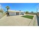 Backyard with artificial grass, desert landscaping and mature palm trees at 907 E Broadmor Dr, Tempe, AZ 85282