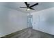 Bedroom features neutral carpet, ceiling fan, and door access to adjacent rooms at 907 E Broadmor Dr, Tempe, AZ 85282