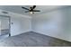Serene bedroom featuring carpet, ceiling fan, and a spacious closet, ideal for a restful retreat at 907 E Broadmor Dr, Tempe, AZ 85282