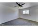Cozy bedroom with neutral carpet, ceiling fan, and window, perfect for relaxation and rest at 907 E Broadmor Dr, Tempe, AZ 85282