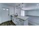 Bright, updated kitchen with granite countertops, stainless appliances, and island open to living area at 907 E Broadmor Dr, Tempe, AZ 85282