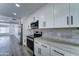 Updated kitchen with stainless appliances, granite counters, and stylish cabinetry, perfect for modern living at 907 E Broadmor Dr, Tempe, AZ 85282
