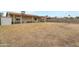 Spacious backyard with covered patio, desert landscaping, and secure fencing for added privacy at 9157 W Gary Rd, Peoria, AZ 85345