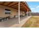 Covered backyard patio offering ample shade and a view of the spacious, fenced-in yard at 9157 W Gary Rd, Peoria, AZ 85345