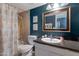 Stylish bathroom features a shower with a rainbow-themed curtain and a vanity with a granite countertop at 9157 W Gary Rd, Peoria, AZ 85345