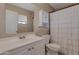 Bright bathroom with a large mirror, white vanity, and shower with curtain at 9157 W Gary Rd, Peoria, AZ 85345