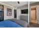 Cozy bedroom featuring modern decor, a TV, and a neutral color palette at 9157 W Gary Rd, Peoria, AZ 85345