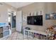 room featuring a TV and organized shelves filled with toys and books at 9157 W Gary Rd, Peoria, AZ 85345
