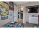 Cozy bedroom featuring neutral walls, playful cartoon wall decor, a TV, and a modern white dresser at 9157 W Gary Rd, Peoria, AZ 85345