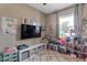 Bright and fun room featuring a large window and play area at 9157 W Gary Rd, Peoria, AZ 85345