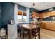 A charming kitchen with a dining area featuring a window that offers an outdoor view of the property at 9157 W Gary Rd, Peoria, AZ 85345
