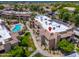 A community aerial view showcases well-maintained landscaping, a sparkling pool, and convenient parking at 9450 E Becker Ln # 1036, Scottsdale, AZ 85260