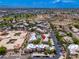 An aerial community view highlights the pool and manicured grounds in a picturesque setting at 9450 E Becker Ln # 1036, Scottsdale, AZ 85260