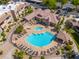 Aerial view of the community pool, clubhouse, and surrounding lush landscape at 9450 E Becker Ln # 1036, Scottsdale, AZ 85260