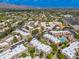 Sprawling aerial view of a community, highlighting lush greenery, landscaped areas, and residential buildings at 9450 E Becker Ln # 1036, Scottsdale, AZ 85260