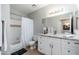 Bathroom featuring a granite countertop vanity with double sinks, a tub, and tiled floors at 9450 E Becker Ln # 1036, Scottsdale, AZ 85260