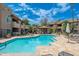 Sparkling community pool with inviting gazebo and comfortable lounge chairs for residents to enjoy at 9450 E Becker Ln # 1036, Scottsdale, AZ 85260