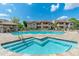Refreshing community pool and spa area with comfortable lounge chairs and lush landscaping at 9450 E Becker Ln # 1036, Scottsdale, AZ 85260
