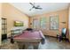 Fun game room with a pool table, flat-screen television, and comfortable seating for residents to enjoy at 9450 E Becker Ln # 1036, Scottsdale, AZ 85260