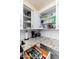Neat kitchen with open cabinets, granite countertops, and drawer organizers offers easy access at 9450 E Becker Ln # 1036, Scottsdale, AZ 85260