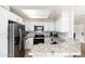 Charming kitchen equipped with stainless steel appliances, granite countertops, and ample cabinet space at 9450 E Becker Ln # 1036, Scottsdale, AZ 85260