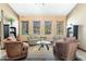 Inviting lounge area with comfortable seating, bookcases, and natural light streaming through the windows at 9450 E Becker Ln # 1036, Scottsdale, AZ 85260
