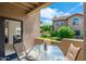 Relaxing patio featuring a table and chairs, with a view of the landscaped grounds and dining area at 9450 E Becker Ln # 1036, Scottsdale, AZ 85260
