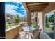 Enjoy outdoor living on this charming patio with a table set overlooking the community pool and lush landscaping at 9450 E Becker Ln # 1036, Scottsdale, AZ 85260