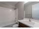 Clean bathroom featuring shower-tub combo and vanity with storage at 98 N Bay Dr, Gilbert, AZ 85233