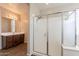 Bathroom showcasing a shower, vanity with dark wood cabinets and tile flooring at 98 N Bay Dr, Gilbert, AZ 85233