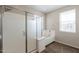 Bathroom including a glass enclosed shower and a separate tub near a window at 98 N Bay Dr, Gilbert, AZ 85233