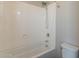 Bright bathroom features a shower over tub with white tiling and chrome fixtures at 98 N Bay Dr, Gilbert, AZ 85233