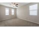 Bedroom with neutral walls, carpet flooring, and natural light from multiple windows at 98 N Bay Dr, Gilbert, AZ 85233