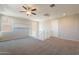 A bright bonus room offering neutral paint, a fan and carpeted flooring at 98 N Bay Dr, Gilbert, AZ 85233